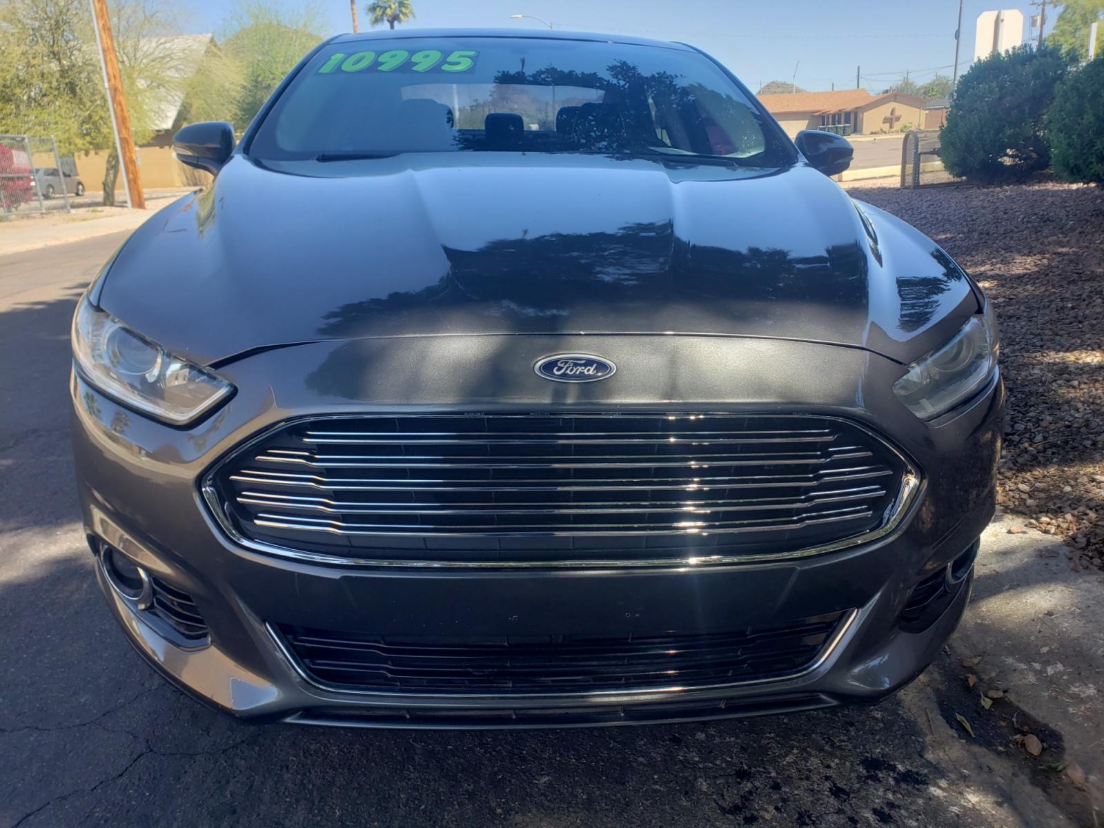 2016 /gray and black Ford Fusion titanium (3FA6P0K99GR) with an 2.0L L4 DOHC 16V engine, 4-Speed Automatic transmission, located at 323 E Dunlap Ave., Phoenix, AZ, 85020, (602) 331-9000, 33.567677, -112.069000 - Photo #1